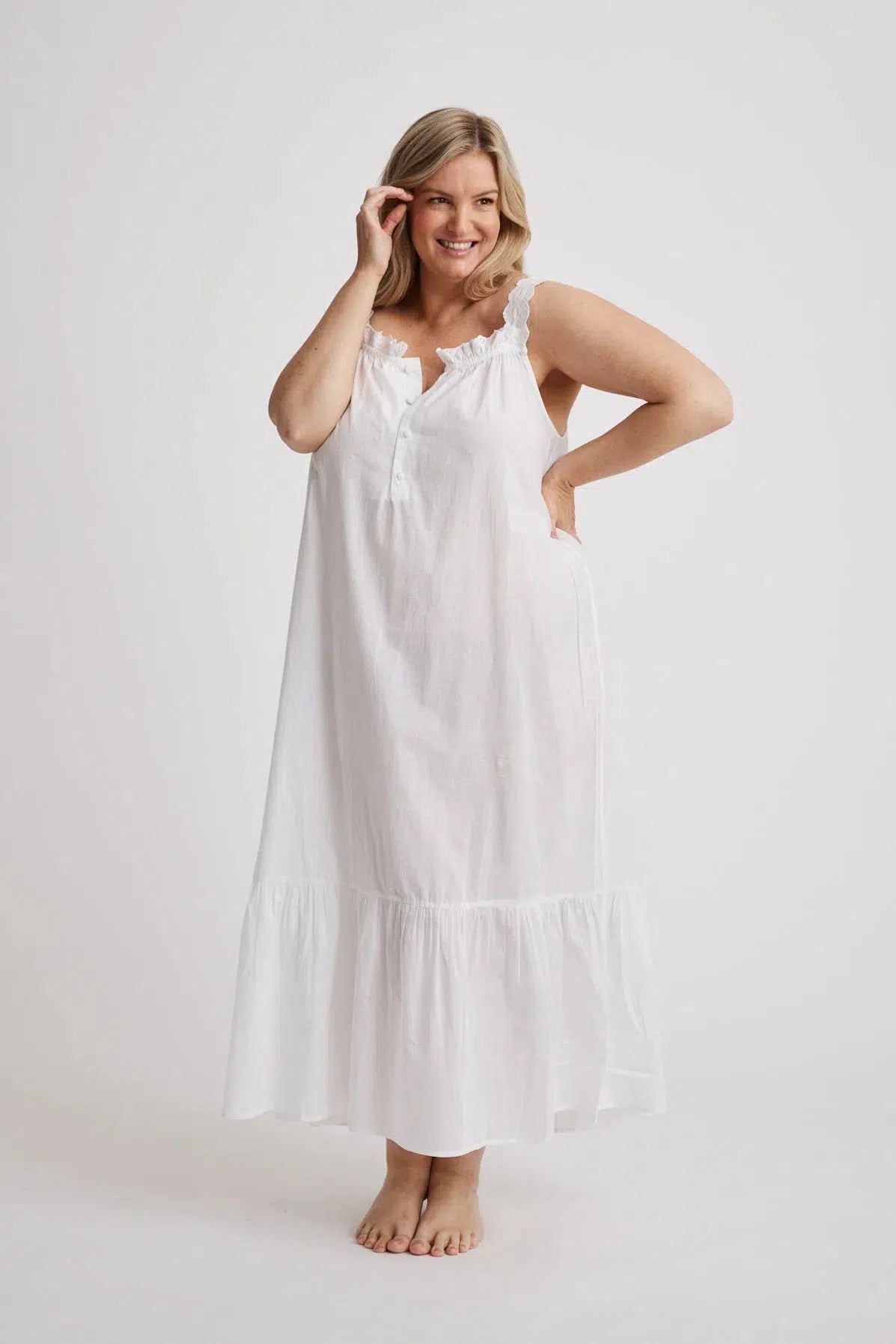 Woman wearing Lauren cotton button-front nightgown in white, inclusive sizes XS–4XL, ideal for hospital stays and recovery