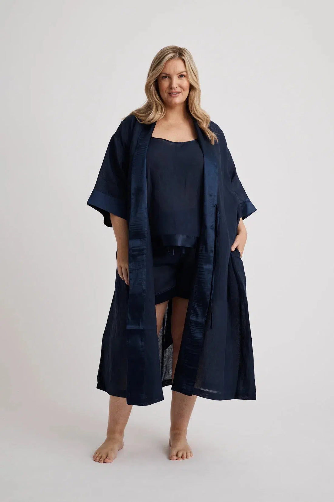 Woman wearing the long Anne linen robe in navy, lightweight cover-up inclusive sizes XS–4XL