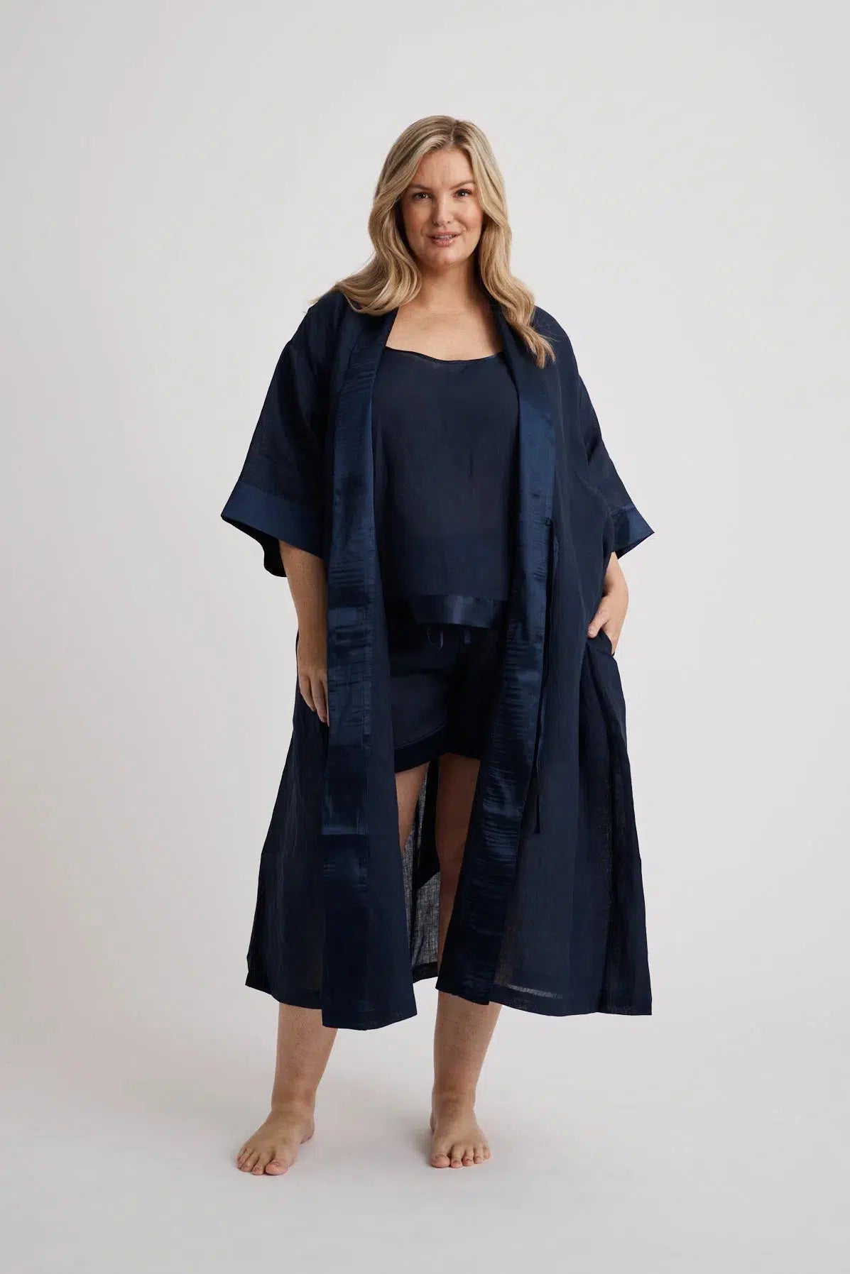 Woman wearing the long Anne linen robe in navy, lightweight cover-up inclusive sizes XS–4XL