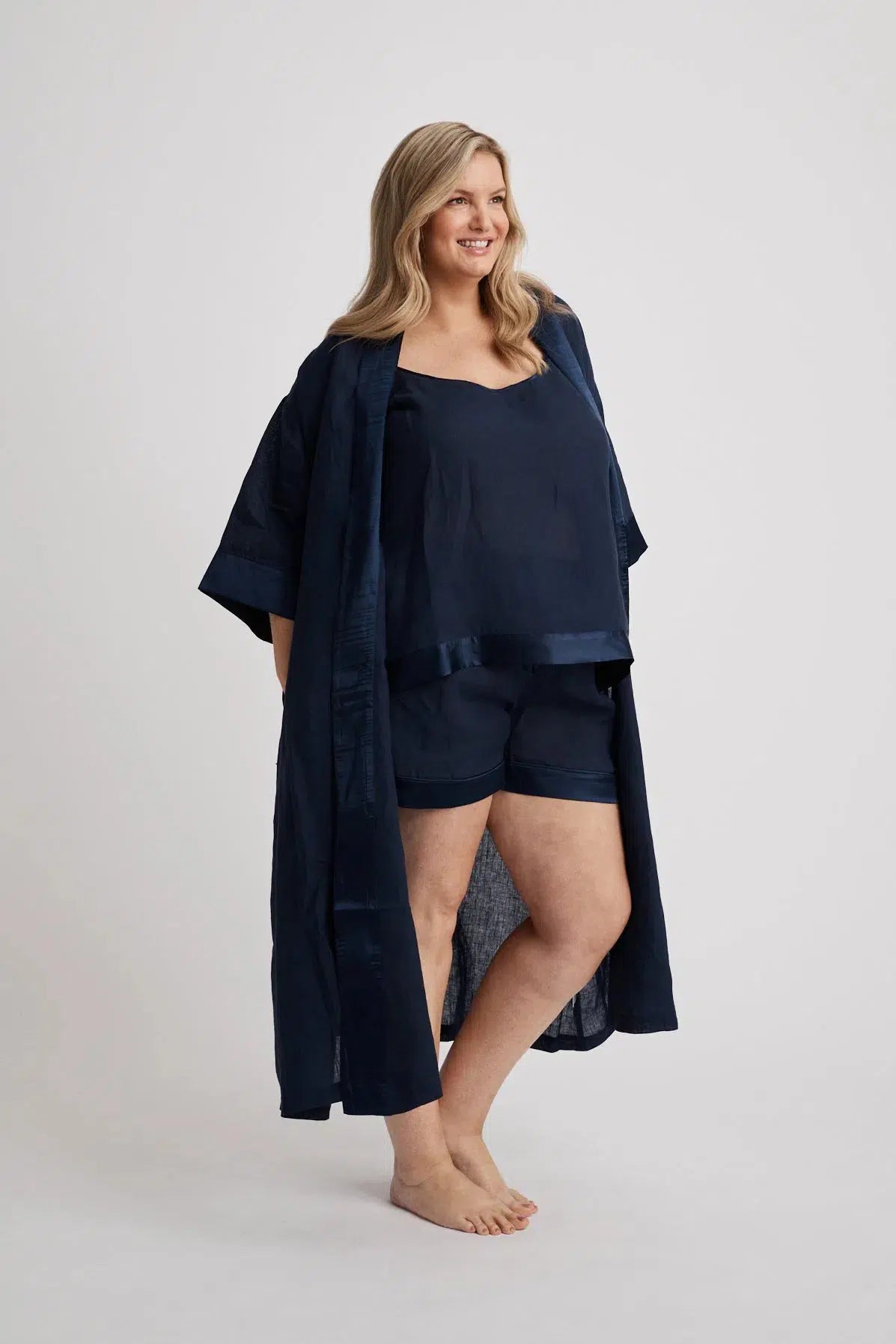 Woman wearing the long Anne linen robe in navy, lightweight cover-up inclusive sizes XS–4XL