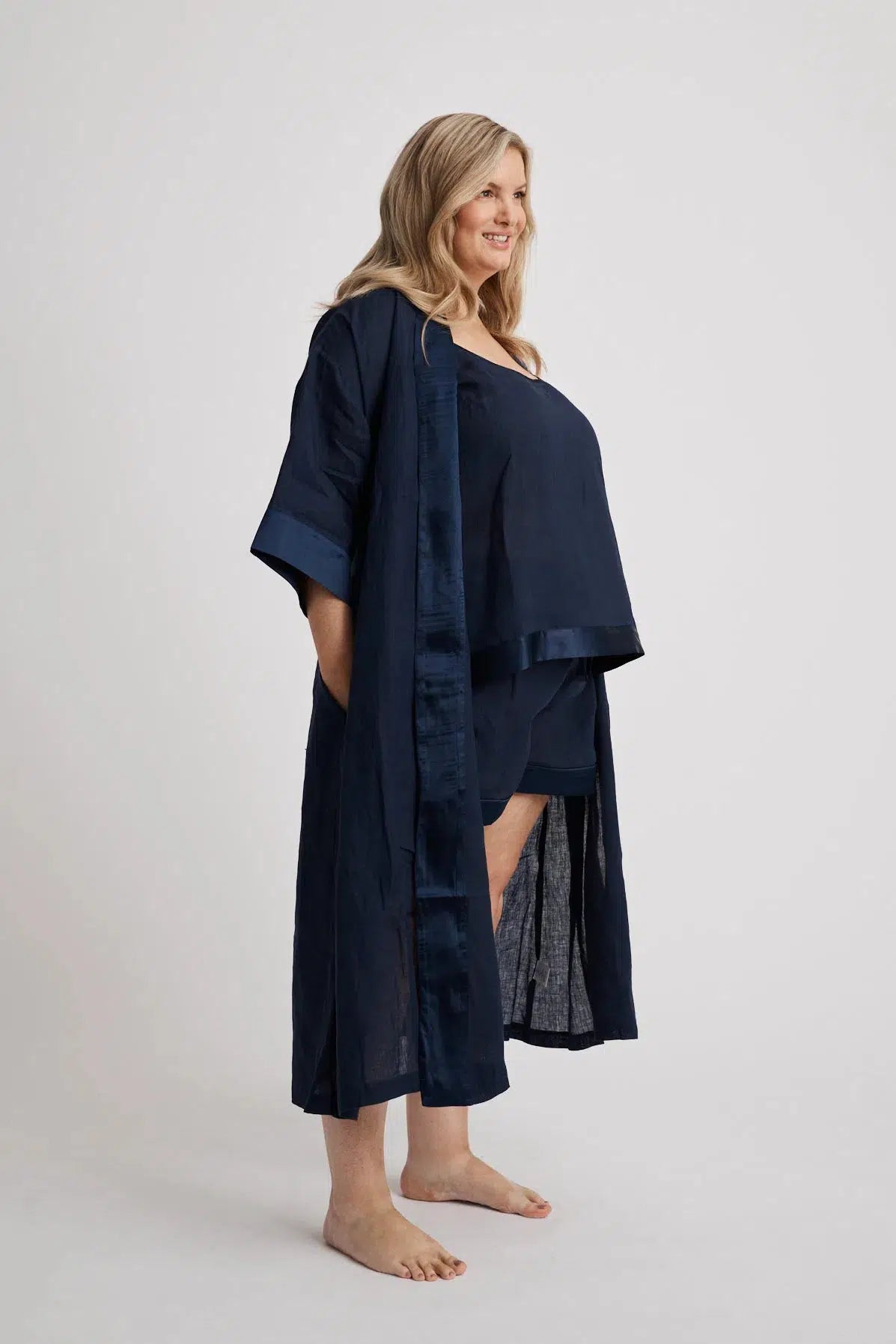 Woman wearing the long Anne linen robe in navy, lightweight cover-up inclusive sizes XS–4XL