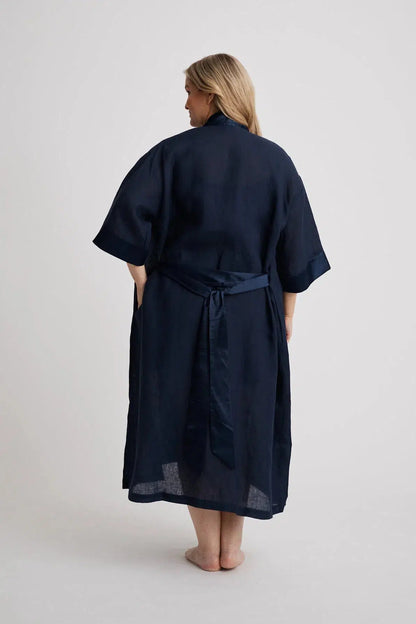Woman wearing the long Anne linen robe in navy, lightweight cover-up inclusive sizes XS–4XL