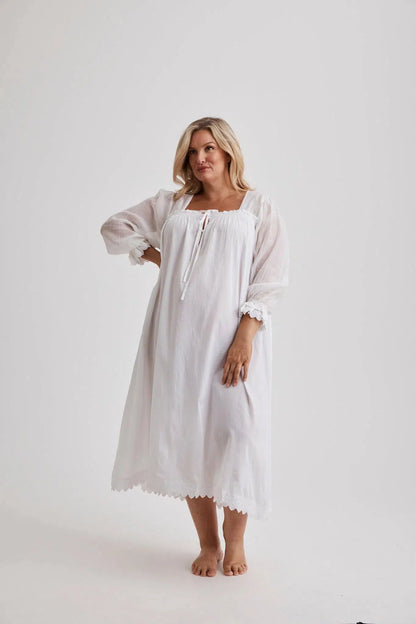 Woman wearing Barbara cotton long-sleeve nightgown in White, inclusive sizes XS–4XL, soft and comfortable for sleep