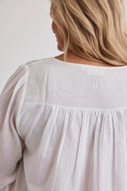 Woman wearing Barbara cotton long-sleeve nightgown in White, inclusive sizes XS–4XL, soft and comfortable for sleep