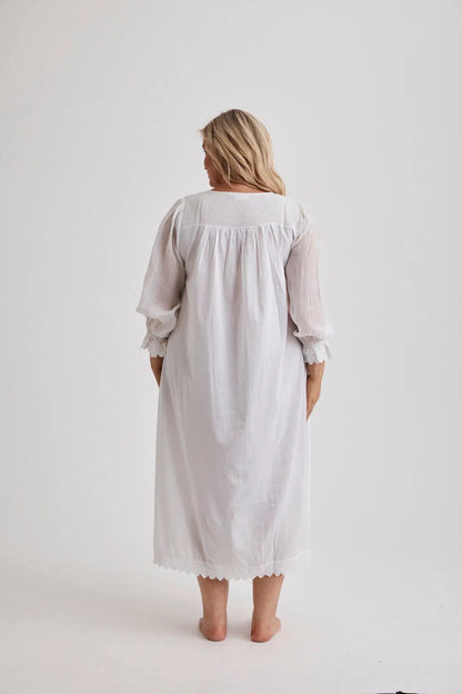 Woman wearing Barbara cotton long-sleeve nightgown in White, inclusive sizes XS–4XL, soft and comfortable for sleep