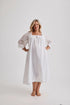 Woman wearing Barbara cotton long-sleeve nightgown in White, inclusive sizes XS–4XL, soft and comfortable for sleep