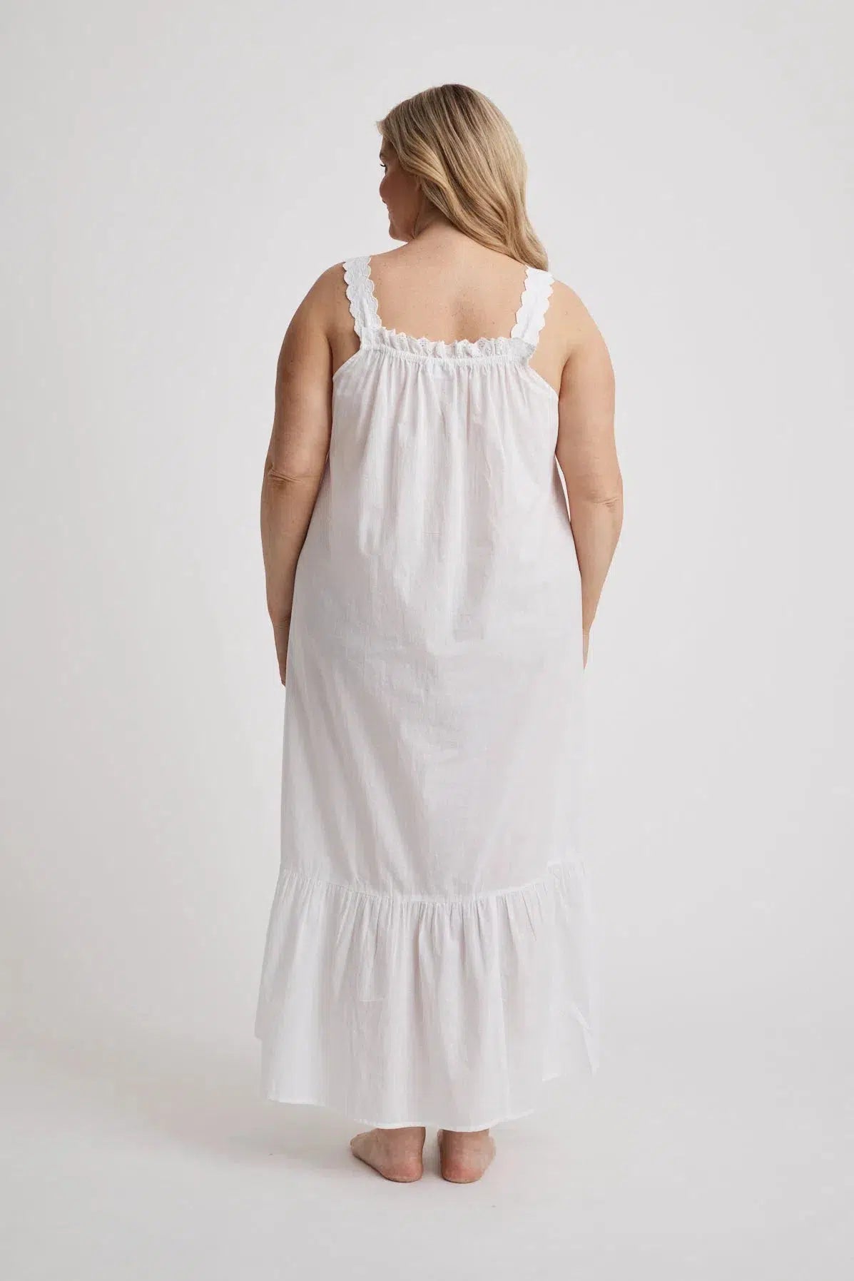 Woman wearing Lauren cotton button-front nightgown in white, inclusive sizes XS–4XL, ideal for hospital stays and recovery