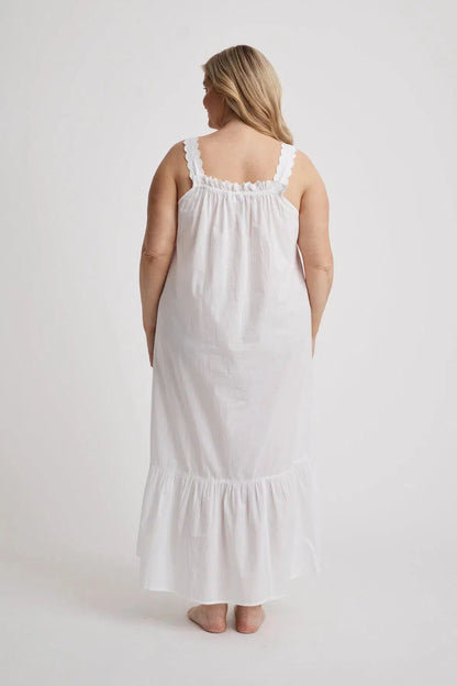 Woman wearing Lauren cotton button-front nightgown in white, inclusive sizes XS–4XL, ideal for hospital stays and recovery