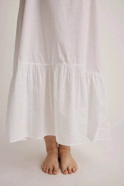 Woman wearing Lauren cotton button-front nightgown in white, inclusive sizes XS–4XL, ideal for hospital stays and recovery