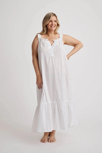 Woman wearing Lauren cotton button-front nightgown in white, inclusive sizes XS–4XL, ideal for hospital stays and recovery